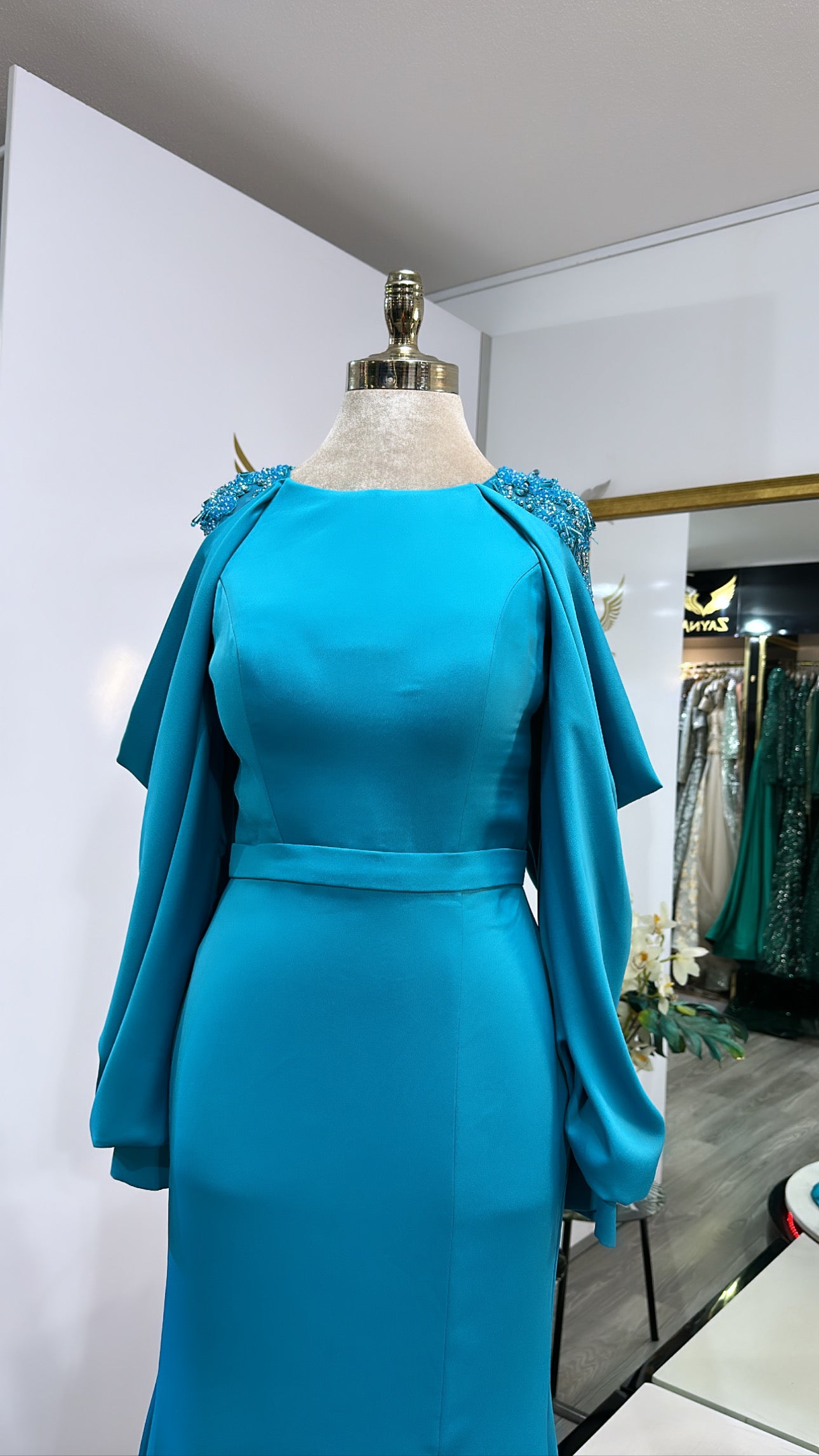 Elegant light blue decorated with beads, slit