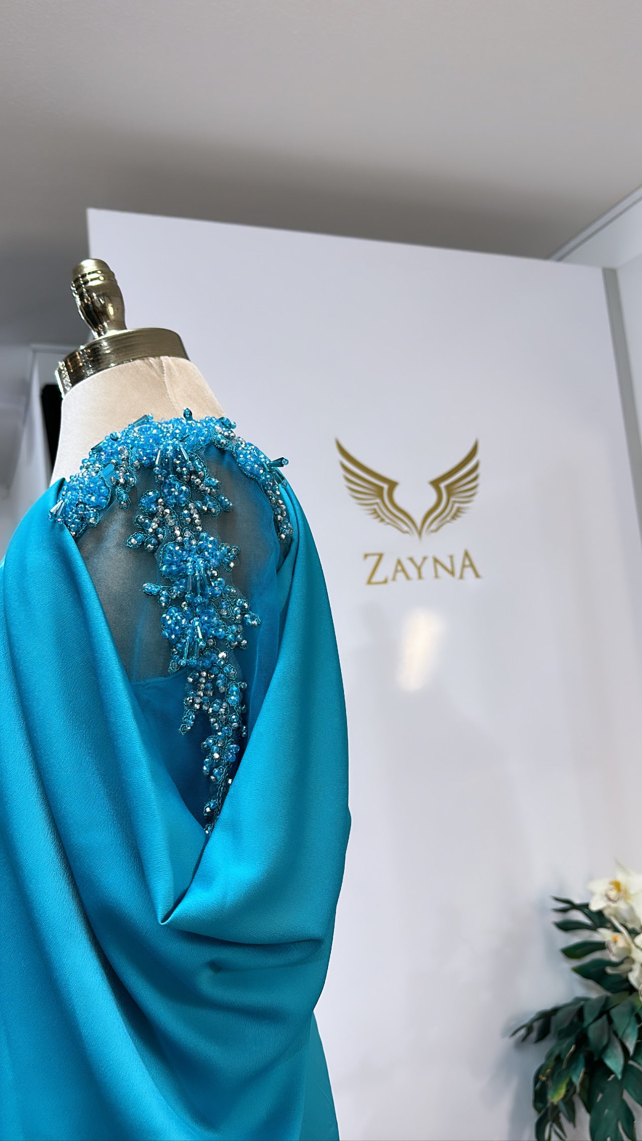 Elegant light blue decorated with beads, slit