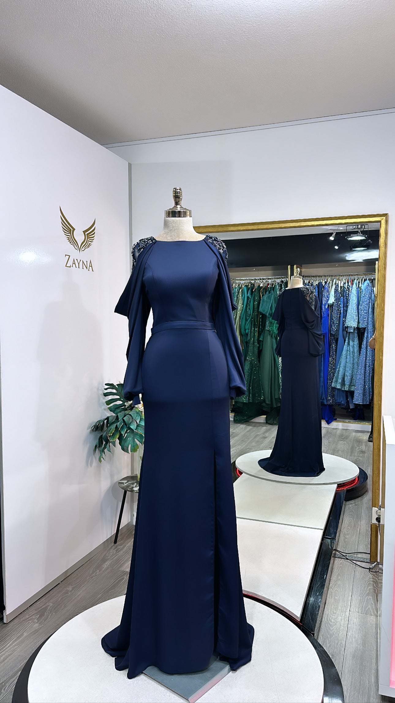 Amazing dark blue dress decorated with beads at the sleeves, split