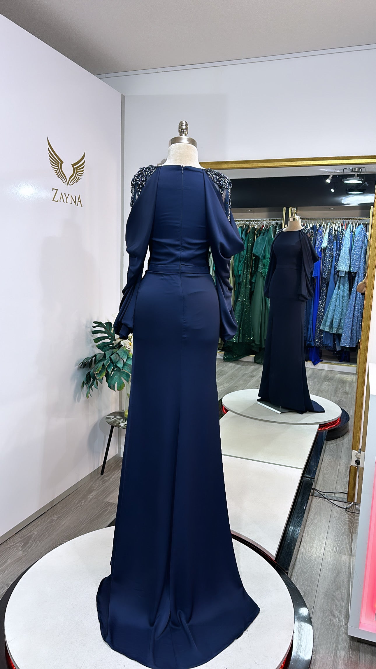 Amazing dark blue dress decorated with beads at the sleeves, split