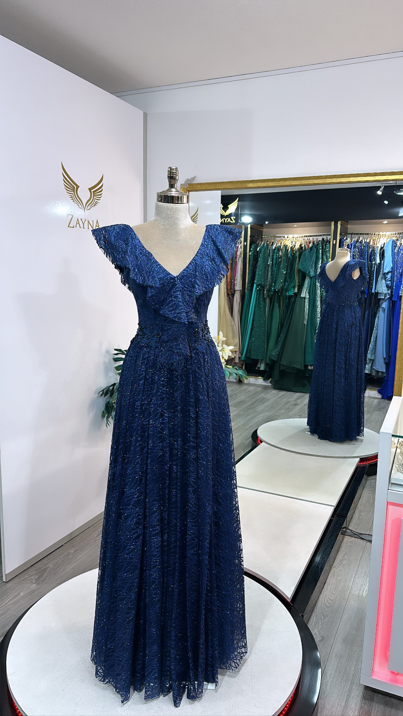 Elegant dark blue dress decorated with beads