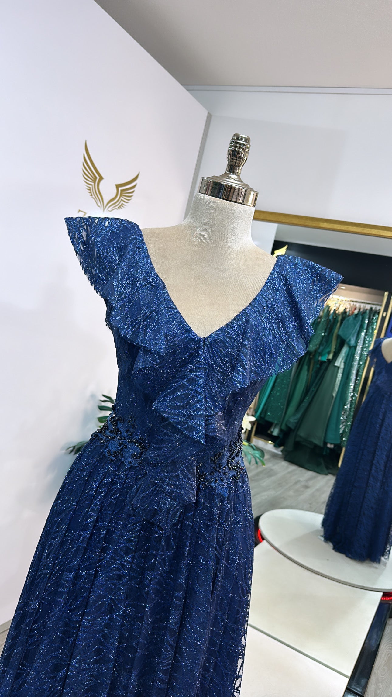 Elegant dark blue dress decorated with beads
