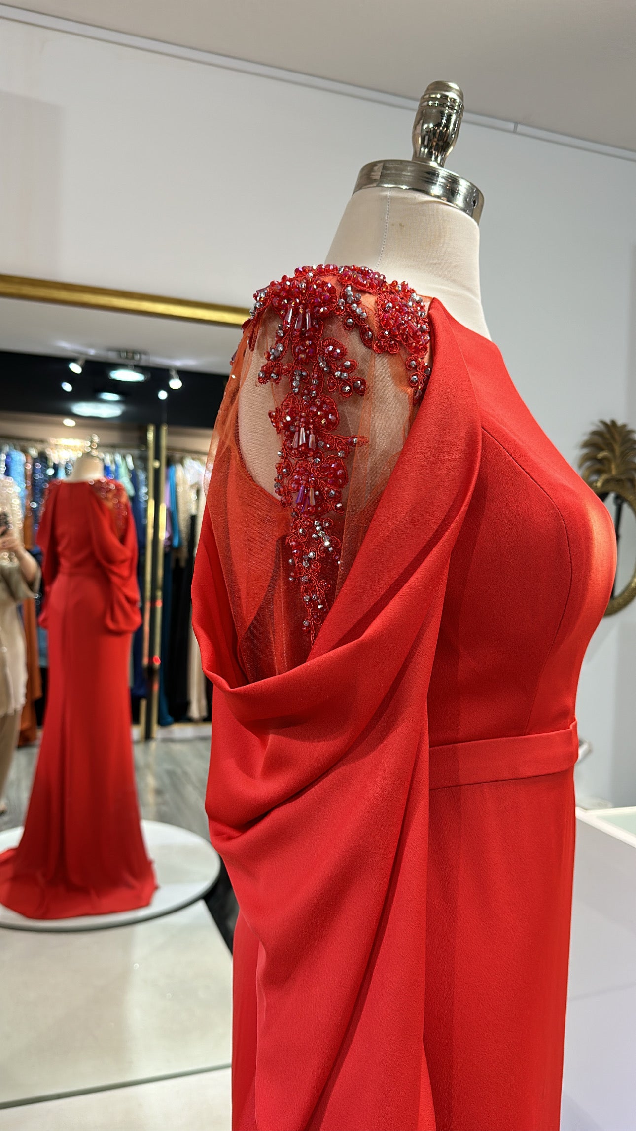 Elegant orange dress decorated with sleeves, split