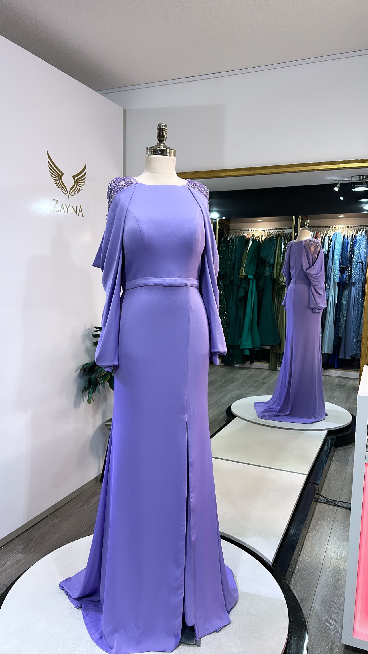 Elegant purple dress decorated with beads, split