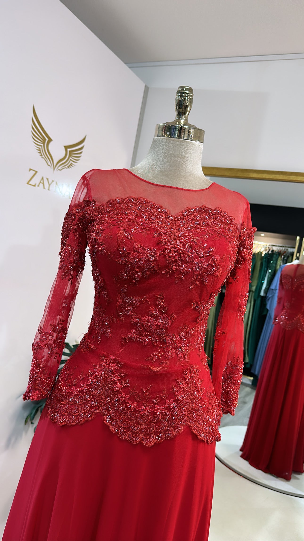 Elegant red dress decorated with beads, headscarf