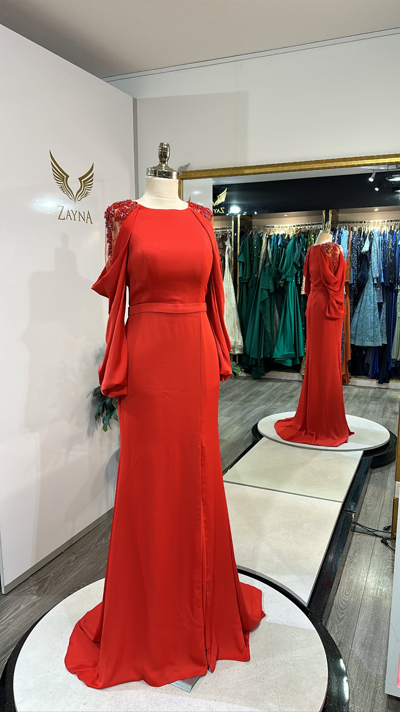 Elegant orange dress decorated with sleeves, split