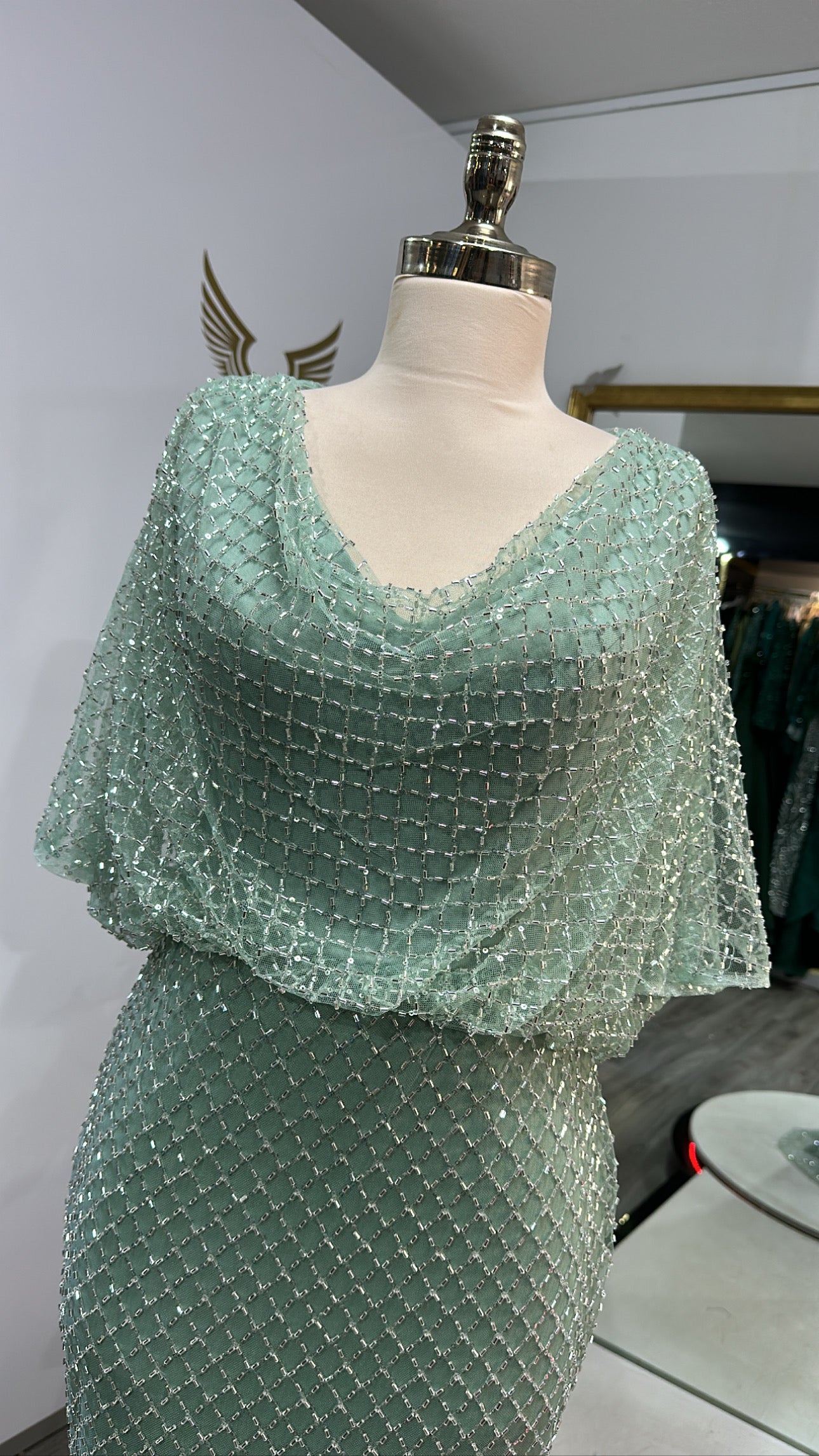 Beautiful mint green dress decorated with beads top and toe