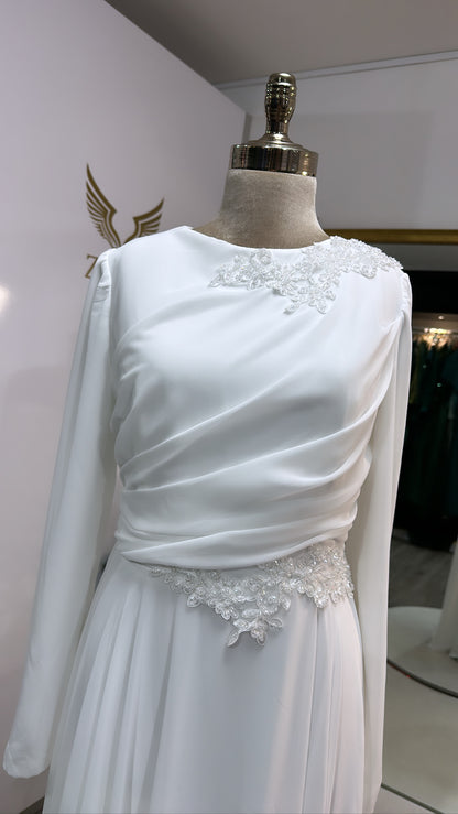 Elegant white dress decorated with beads
