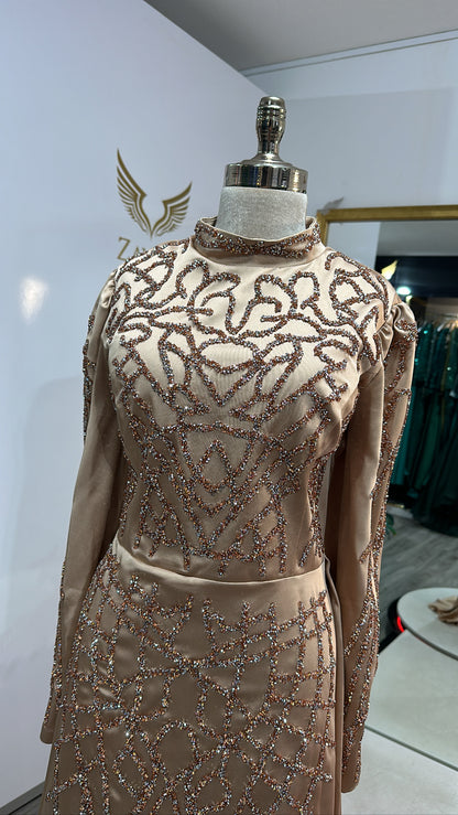Elegant light brown dress decorated with beads, train