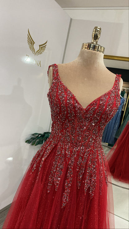 With details, glittering elegant red dress.