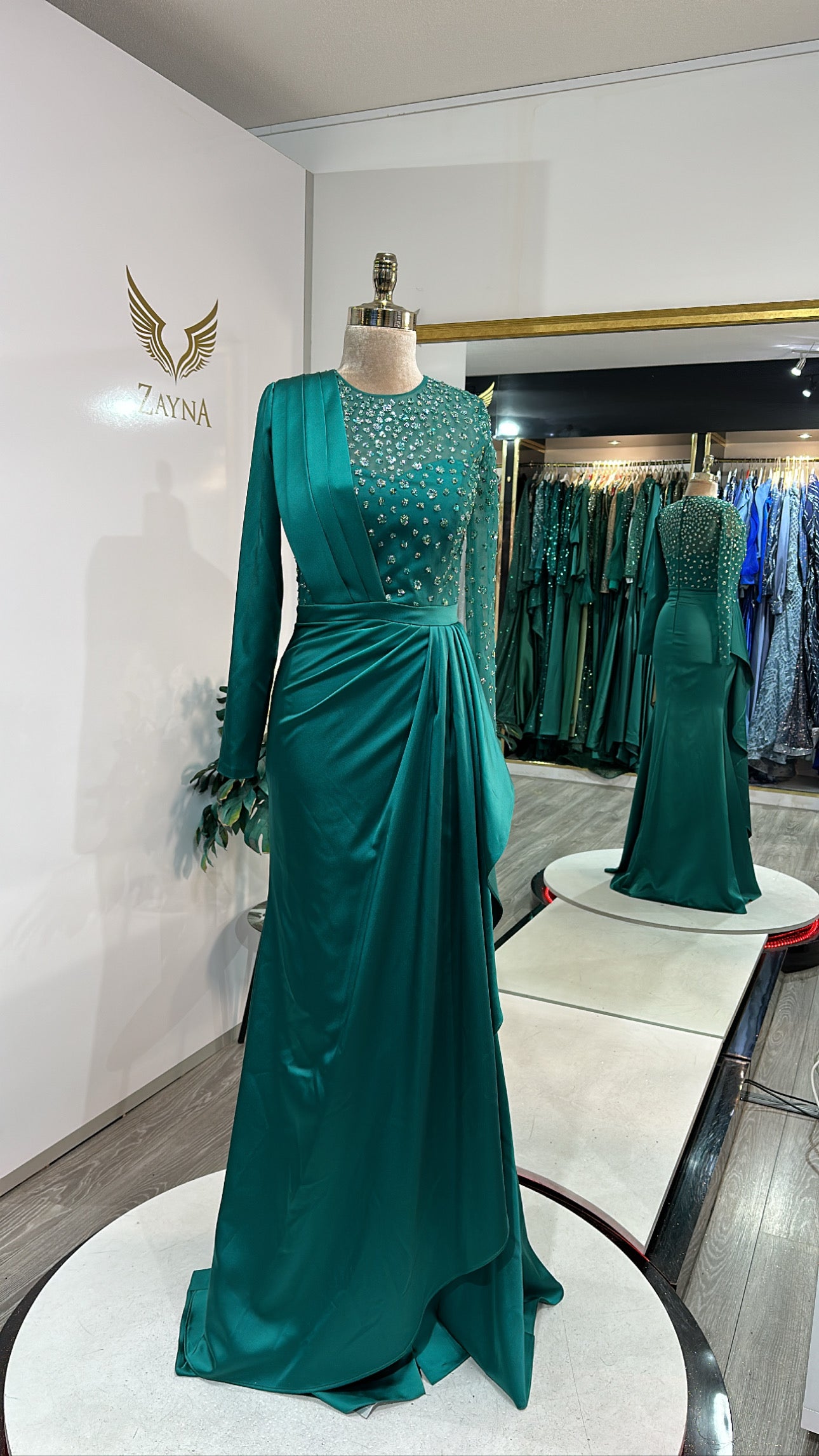 Elegant green dress decorated with beads, satin, design