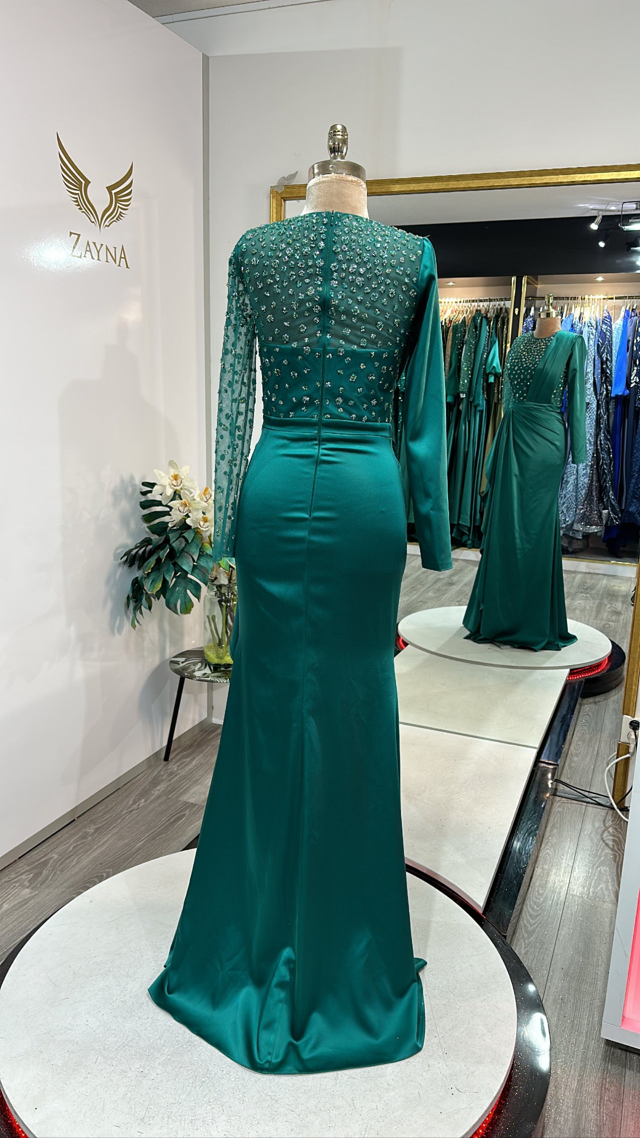 Elegant green dress decorated with beads, satin, design