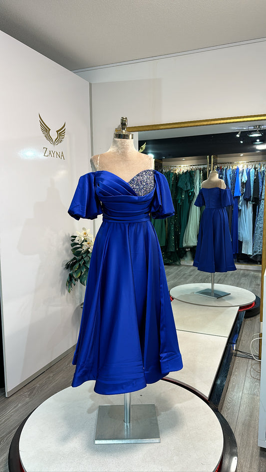 Elegant blue midi dress decorated on one side