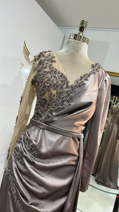 Elegant copper dress decorated with beaded design, satin with split